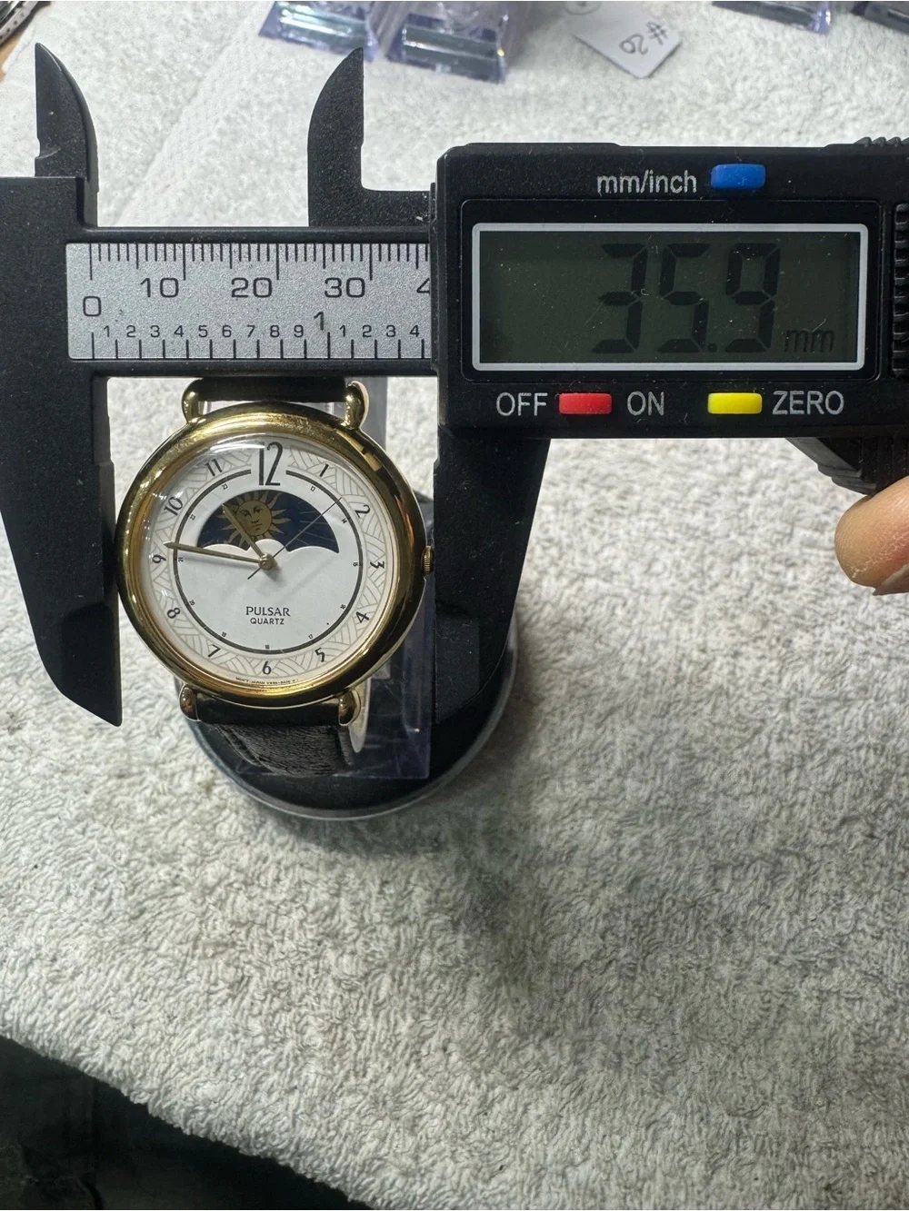 Pulsar Gold Tone Watch with White Dial and Black Strap